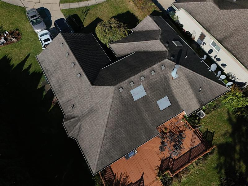 L-shaped home with a deck