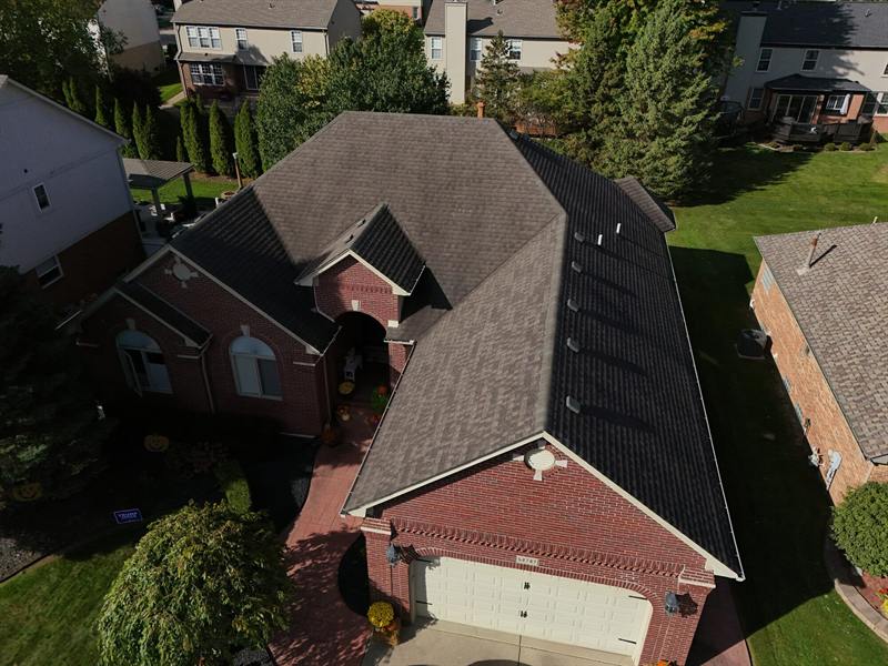 Brick home with a steep new roof