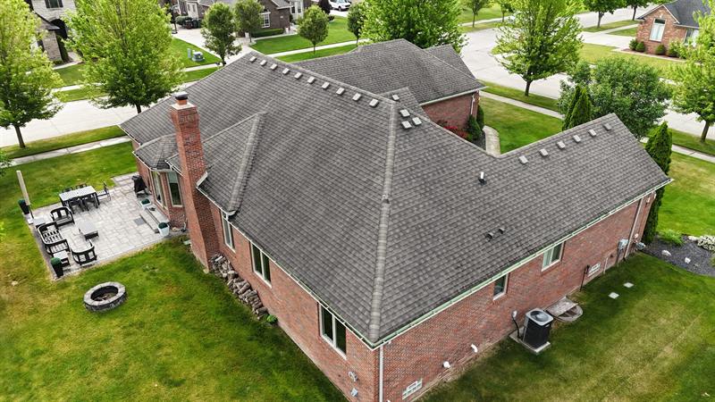 Rear view of a brick ranch with a new roof