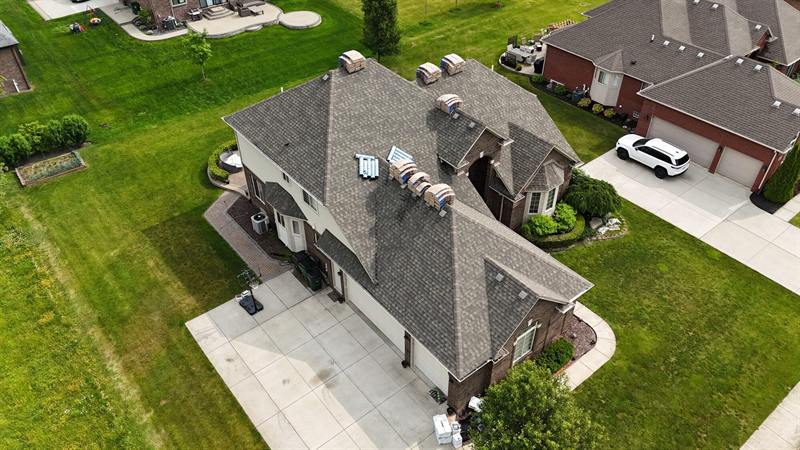 Large home with a complex hip roof