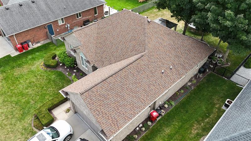 Tan roof on a brick home