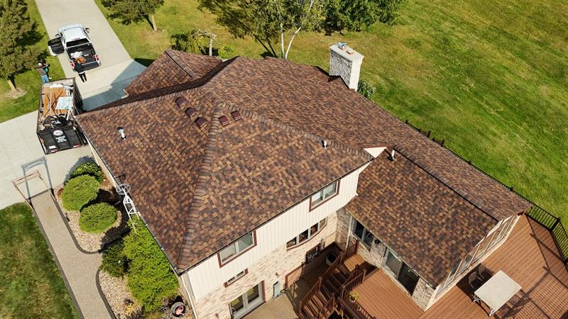 Brown roof on a two-story home