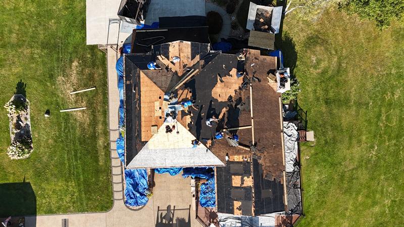 Tear-off with tarps protecting the yard