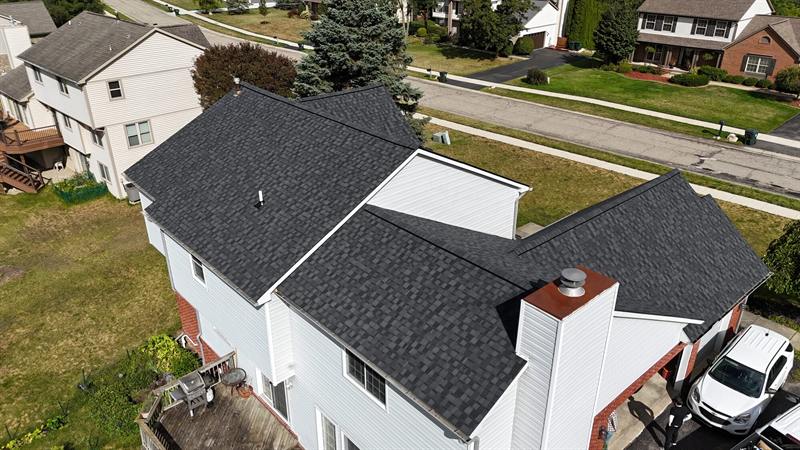Side view of a colonial with a new roof