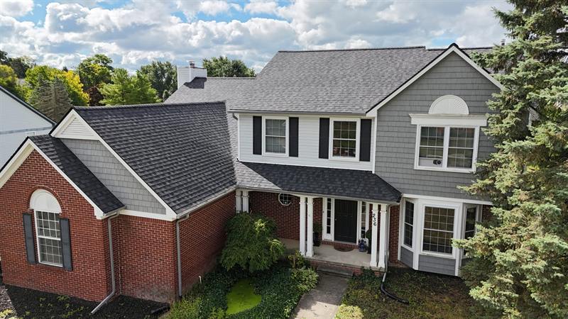 Two-story colonial with a new gray roof