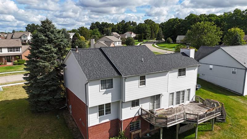 White colonial with deck and new roof