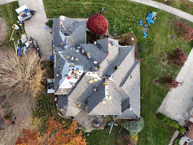 Complex roof mid-install in the fall